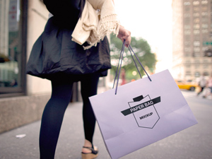 Paper Bag Held in Hand Mockup