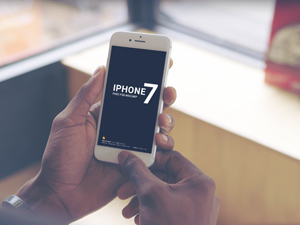 White iPhone 7 Holding in Hand Mockup